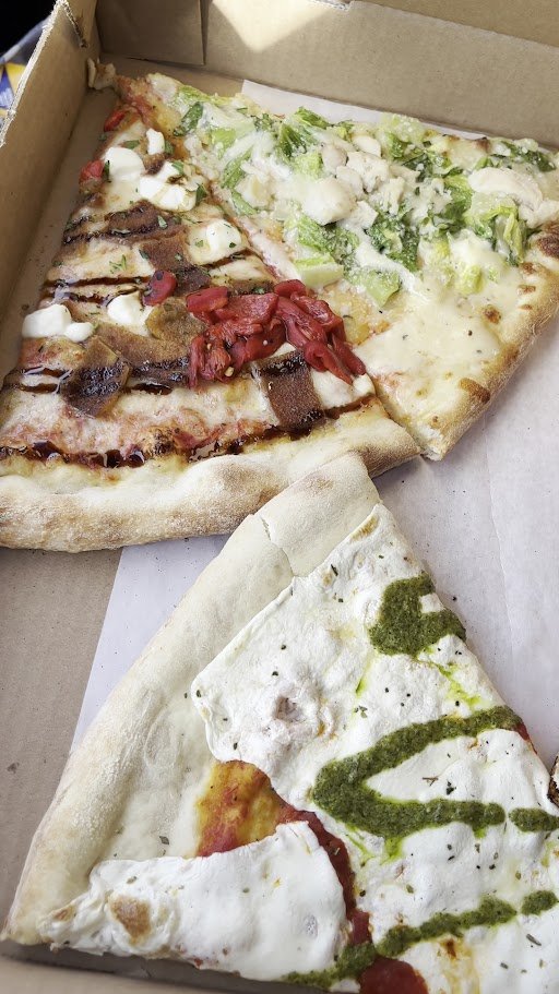 Tables set inside a family-friendly pizza parlor.